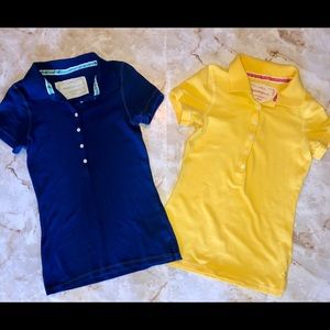 Two, short sleeve polo-style shirts.